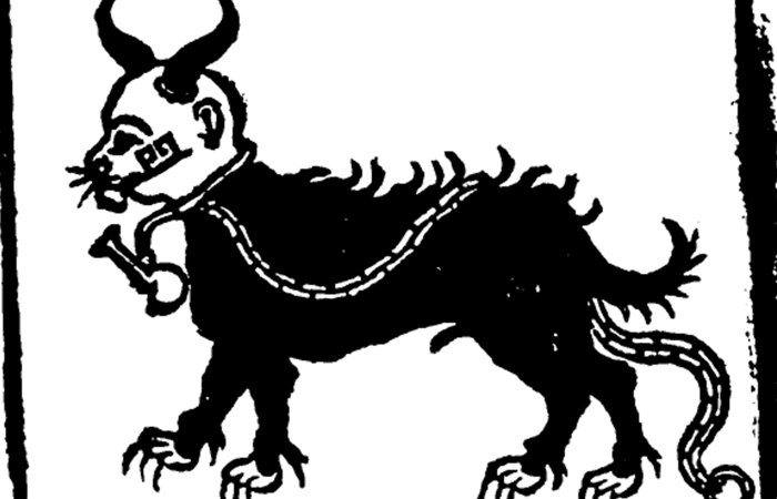A crude woodcut of a black horned cat-like creature standing in profile, wearing a chain around its body and holding a small horn in its mouth.