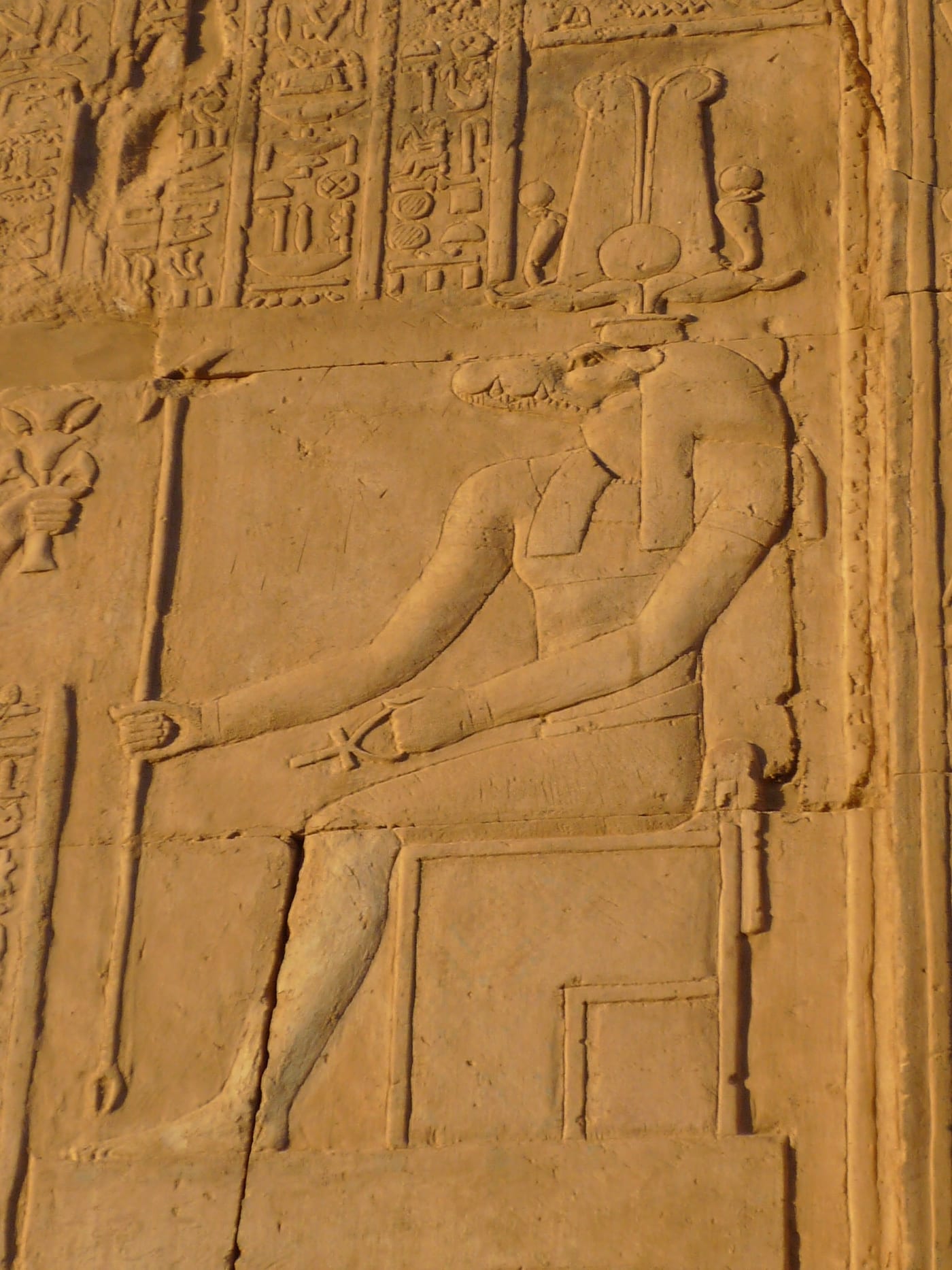 Wall relief at the Temple of Kom Ombo, Upper Egypt, showing crocodile-headed Sobek in a procession of deities with offering bearers, Ptolemaic period c. 180–47 BCE.