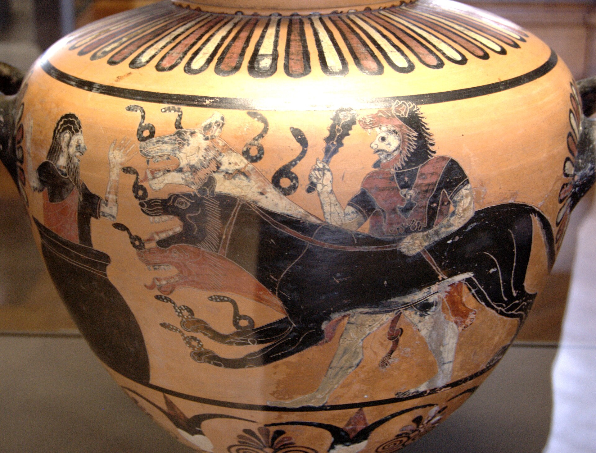 Roman marble relief showing Cerberus, the three-headed dog guarding the entrance to Hades, with the figures of Heracles leading Cerberus, 2nd century CE, Louvre Museum.