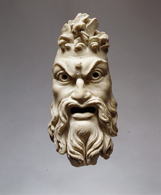 Roman marble mask of Pan, a bearded face with an open mouth, heavy brows, pointed animal ears and two short curved goat horns rising from the hair.