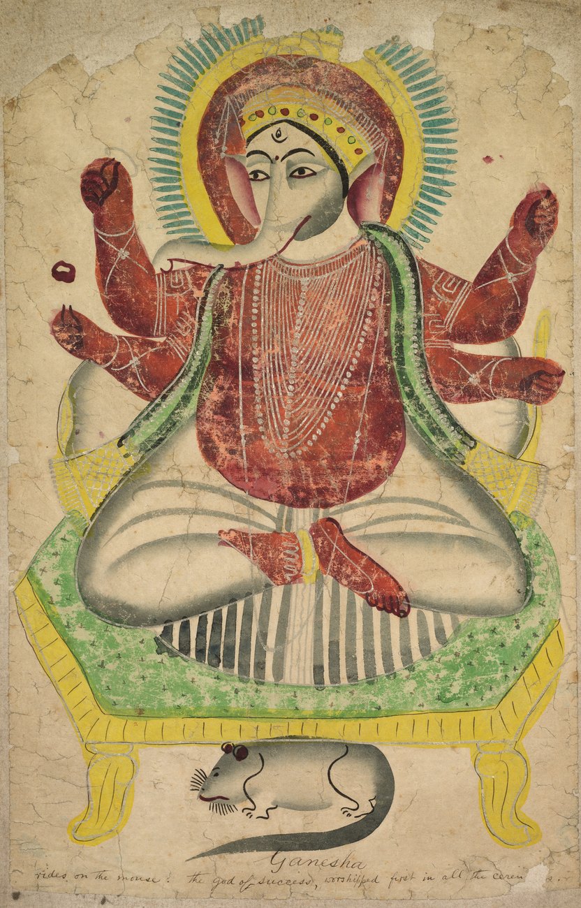Kalighat painting of a six-armed Ganesha with an elephant head seated cross-legged on a green and yellow throne, with a white mouse drawn beneath the throne and a handwritten English inscription along the bottom edge.