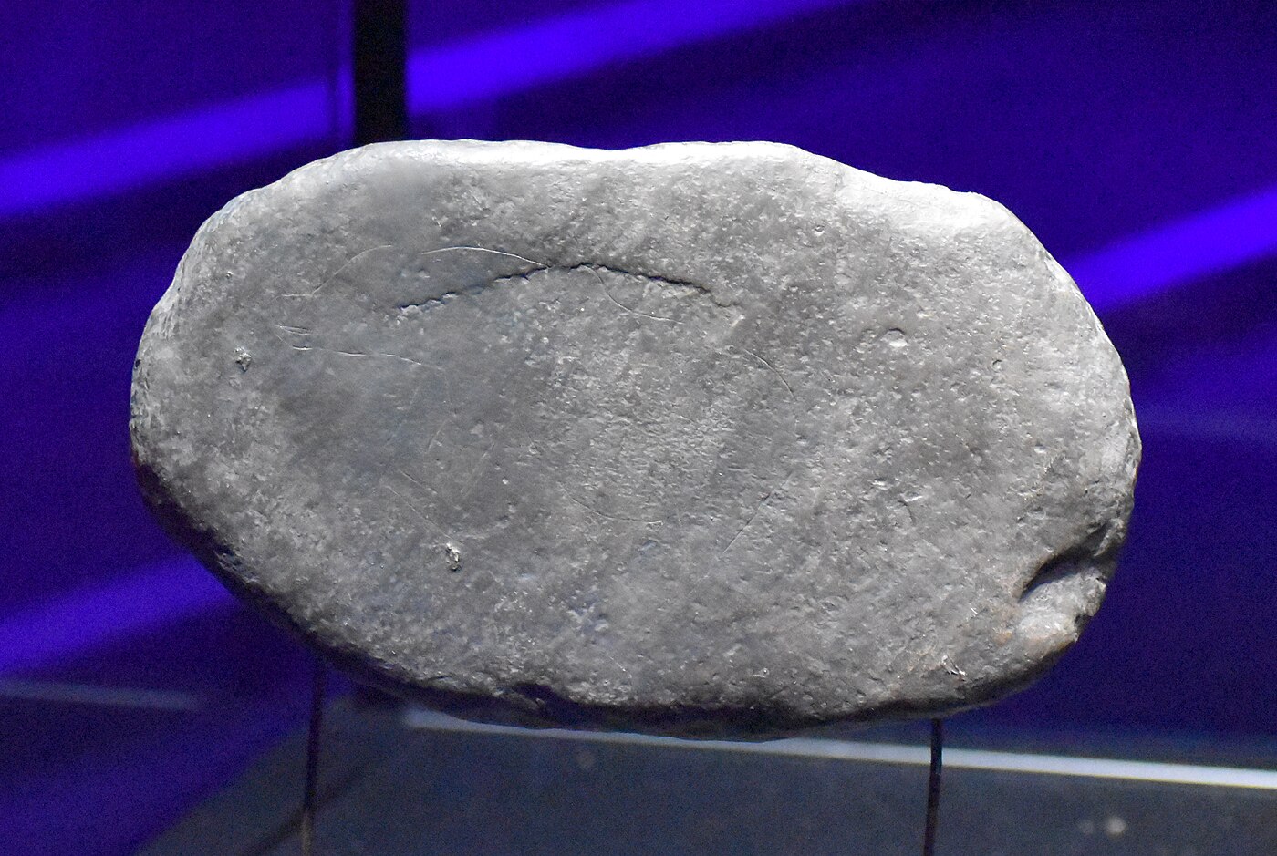 Cast of an engraved bear figure on a pebble from Massat, Ariège, France, Paleolithic period, displayed at the Parc de la Préhistoire.