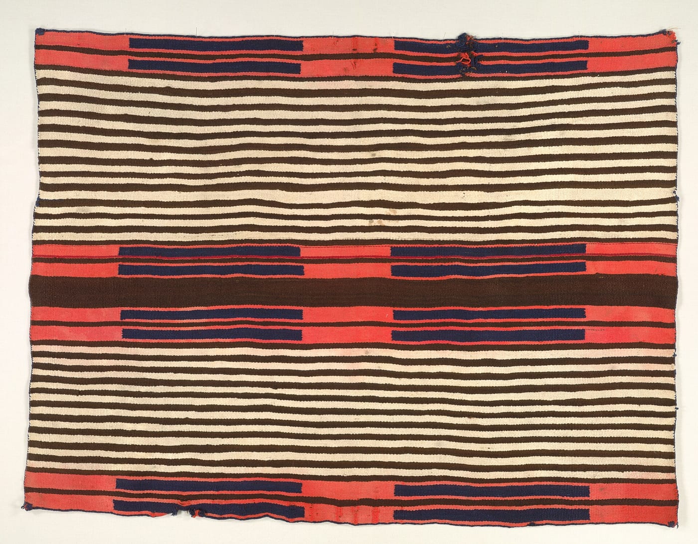 Classic-period Navajo blanket with geometric pattern, c. 1850–1870, wool, woven on a traditional loom, Museum of Indian Arts and Culture, Santa Fe.
