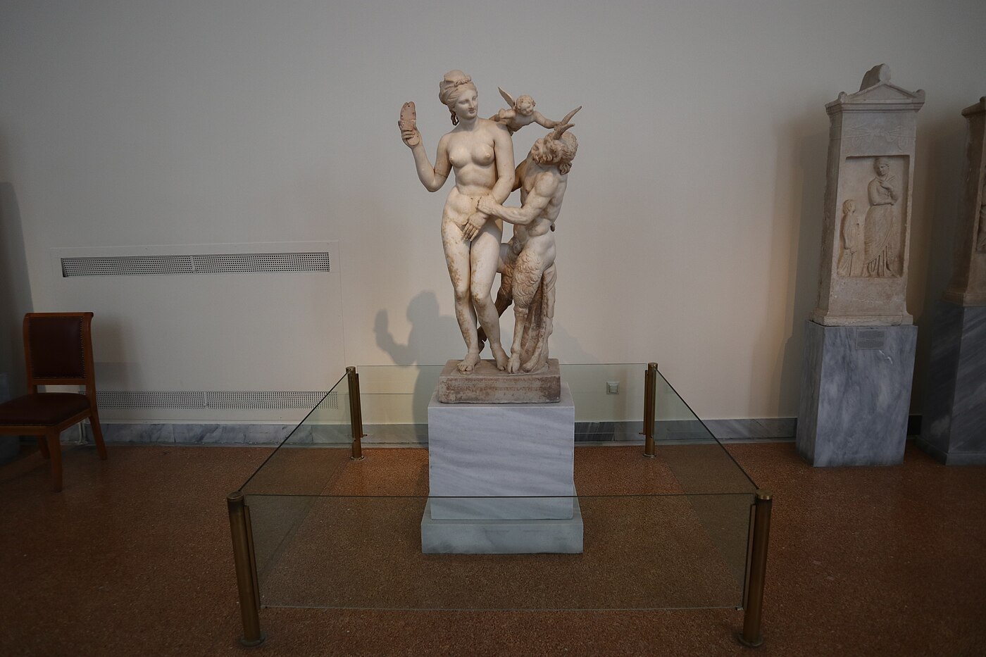 Marble sculptural group of Aphrodite threatening Pan with her sandal while Eros intervenes, from Delos, c. 100 BCE, National Archaeological Museum Athens inv. 3335.
